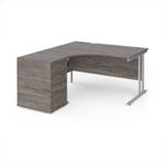 Maestro 25 left hand ergonomic desk 1400mm with silver cantilever frame and desk high pedestal - grey oak
