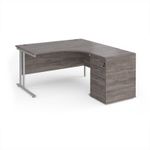 Maestro 25 right hand ergonomic desk 1400mm with silver cantilever frame and desk high pedestal - grey oak