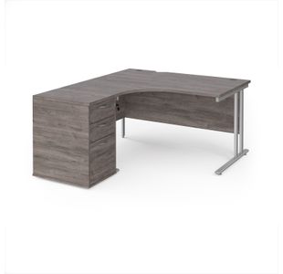Maestro 25 left hand ergonomic desk 1400mm with silver cantilever frame and desk high pedestal - grey oak